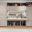 Maxi Bar open within a custom wall system with serving counter, bottle storage, glassware, shelving, and display cabinets.