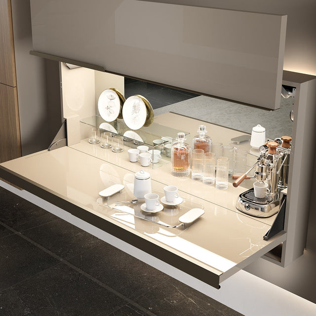 Maxi Bar wall-mounted bar cabinet open with serving surface, mirrored back panel, glassware, bottles, and espresso machine.