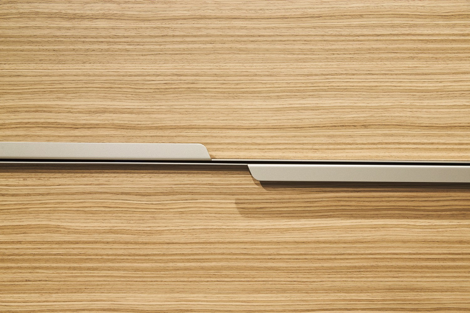 Close-up of the Maxi Bar wood front panel and horizontal pull detail.