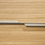 Close-up of the Maxi Bar wood front panel and horizontal pull detail.