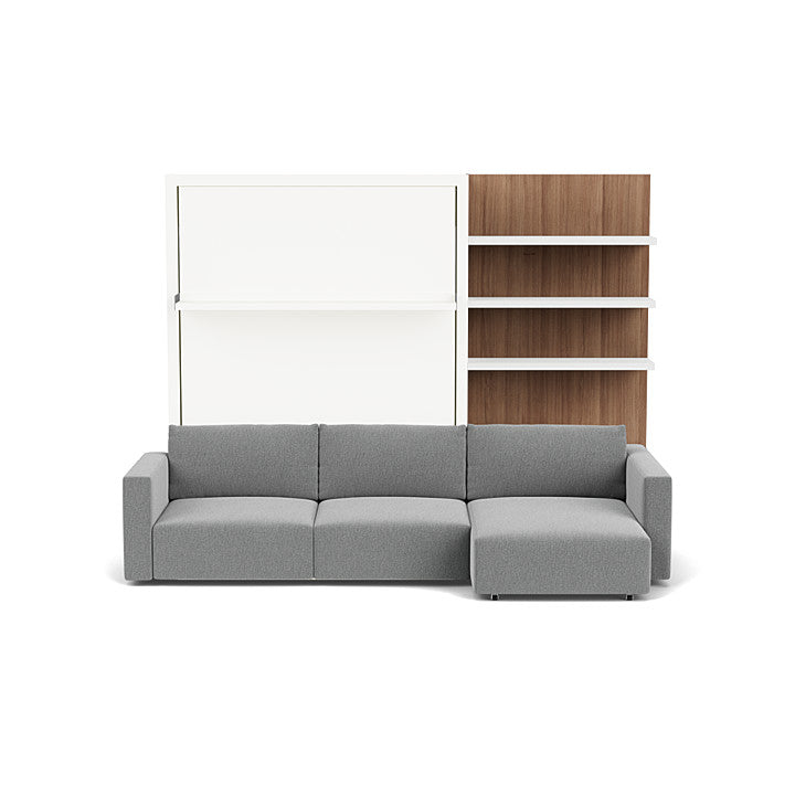 Swing Chaise Murphy bed system in closed position with gray sectional sofa and wood-paneled shelving unit.