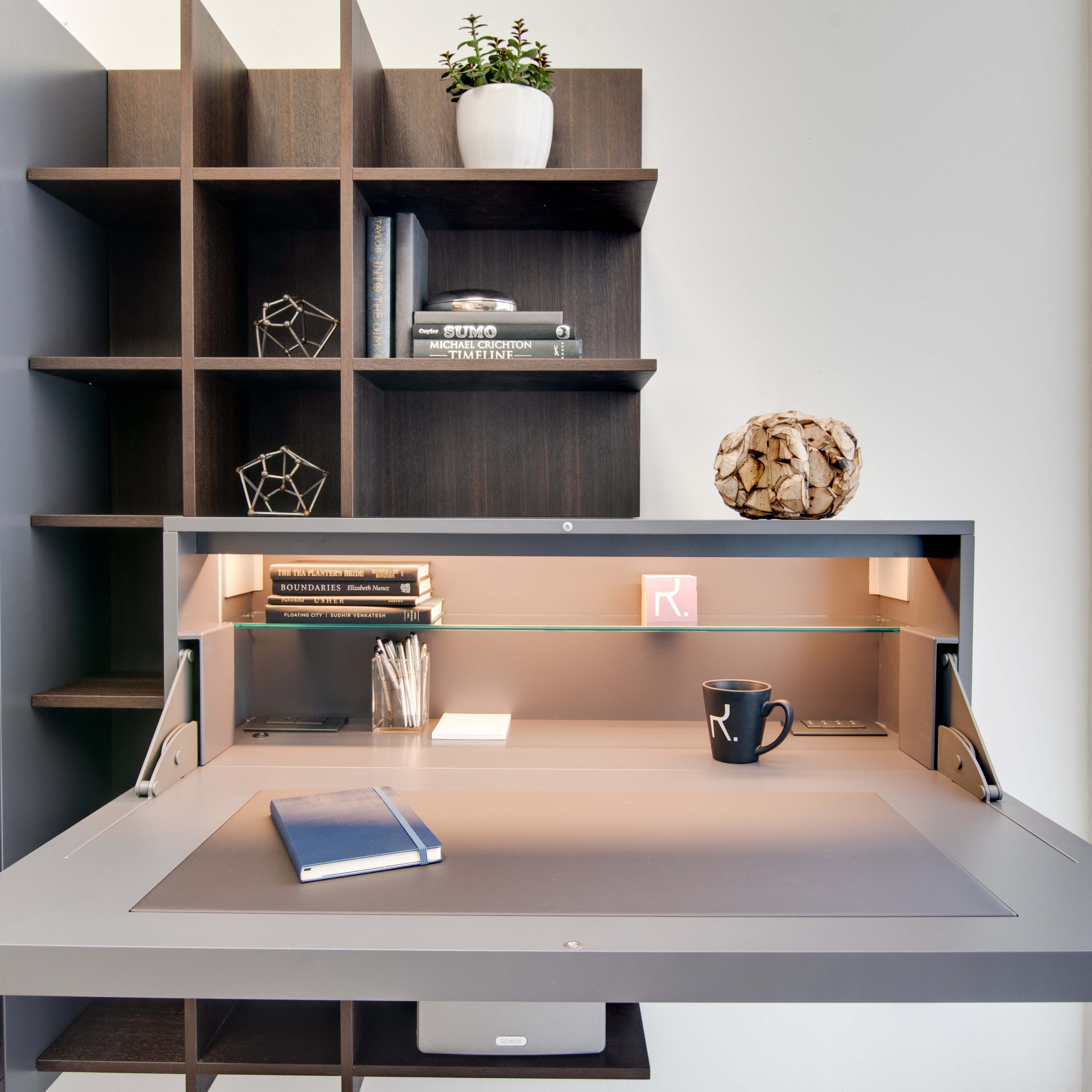 Fold away desk with outlet storage