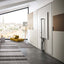 Altea Work murphy bed in vertical closed position with the desk neatly folded away, revealing the bed’s compact hidden form against built-in cabinetry.