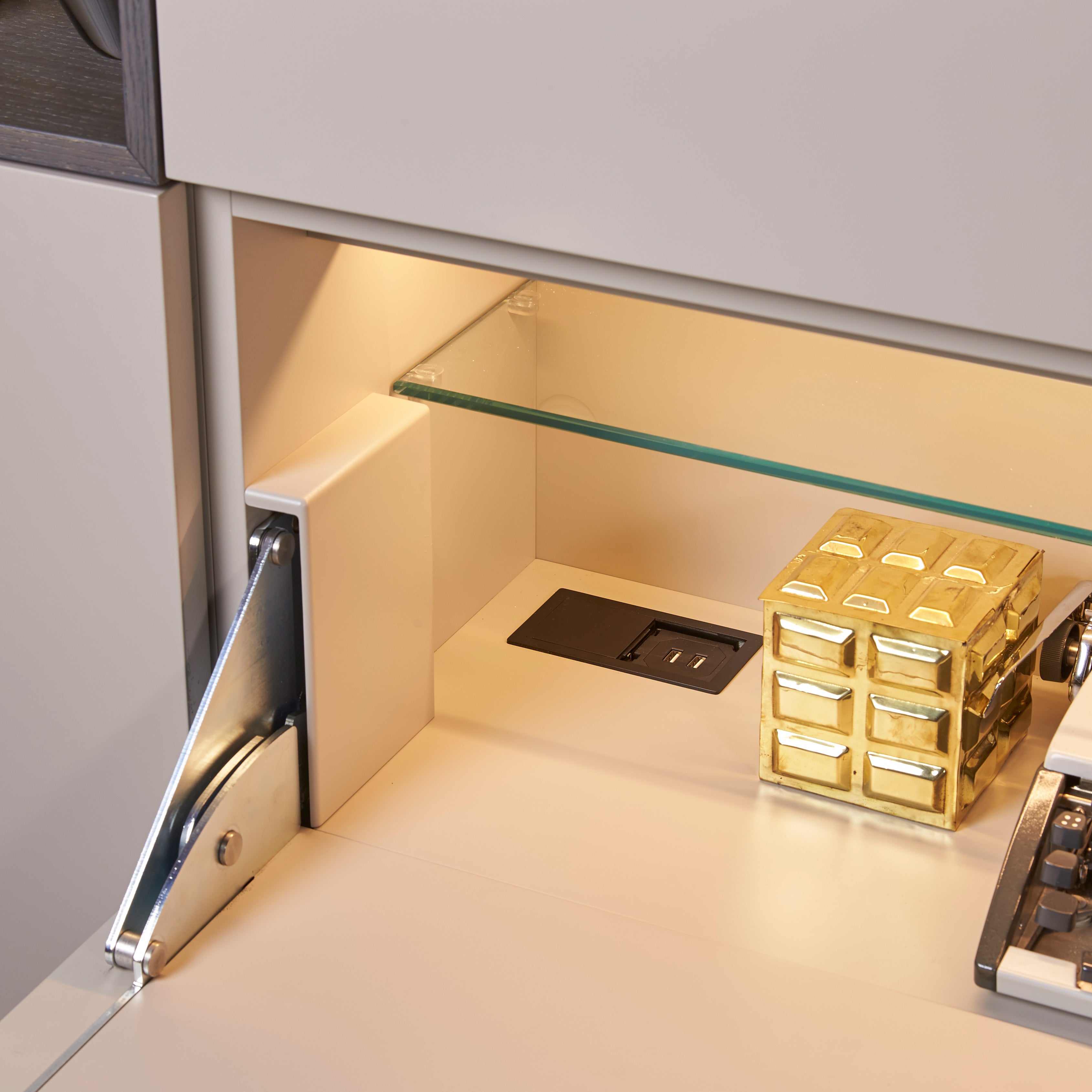 Custom cabinetry units desk detail with built-in USB outlet and modern hardware — space-saving furniture by Resource Furniture.