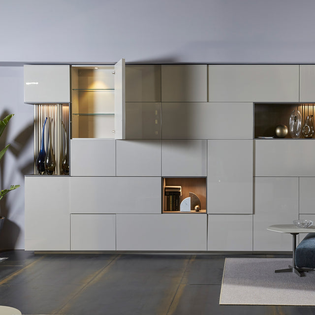 Custom cabinetry units with open cabinet doors and illuminated shelving — modern wall-mounted storage system by Resource Furniture.