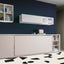 Closed Kali horizontal twin Murphy bed shown as a sleek beige cabinet with adjacent open shelving and minimalist decor.