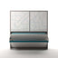 Wall bed in mid-transition with teal desk remaining level as bed lowers.