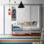 Kali Ponte wall bed shown open with integrated desk and shelving in a colorful kids’ room with closet.