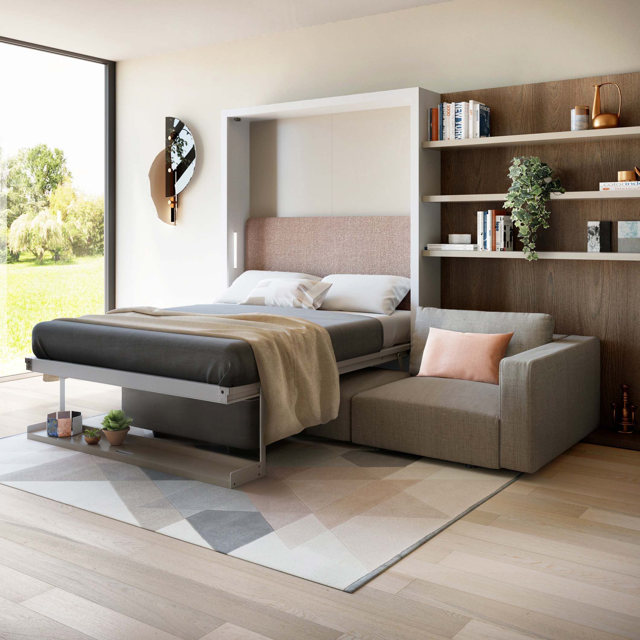 Queen-size Murphy bed extended with pink upholstered headboard and integrated chaise sofa in a multifunctional furniture setup.