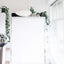 Queen Murphy bed with a white frame closed against a white wall in a modern kitchen interior.
