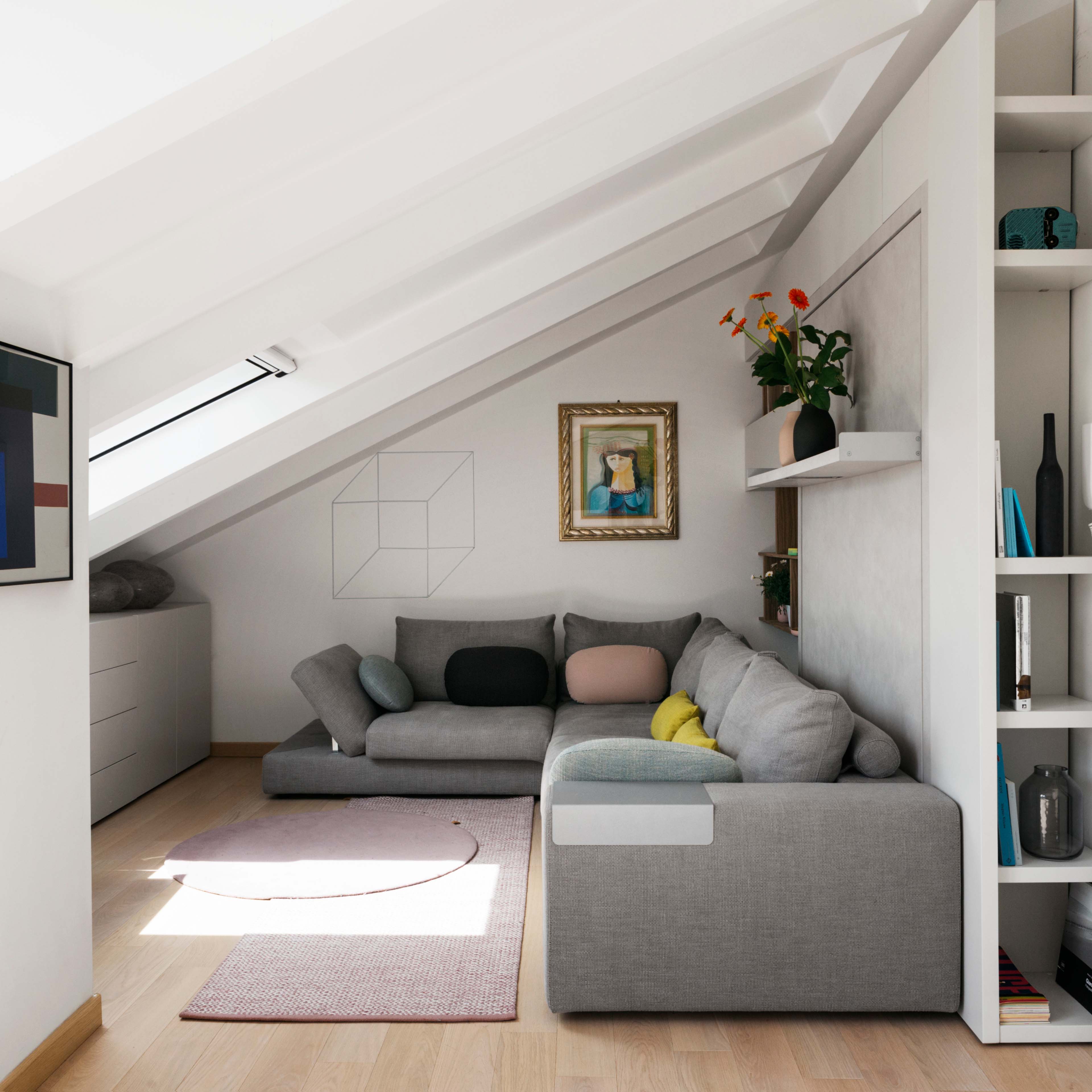 Tango Sectional from Resource Furniture in a modern attic living space, featuring a modular design and integrated wall bed system.