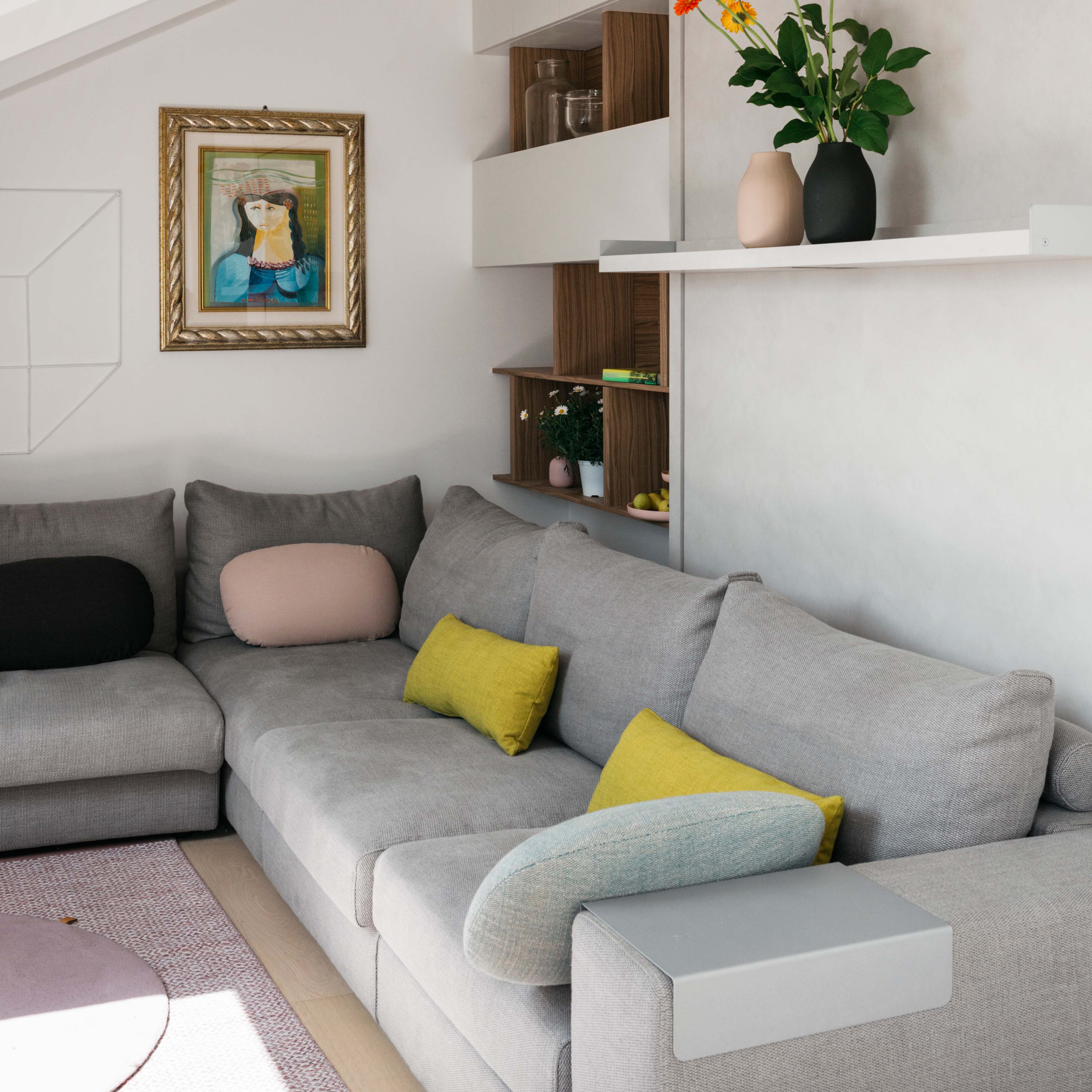 Tango Sectional Murphy bed in sofa configuration with modular gray couch and built-in shelving.