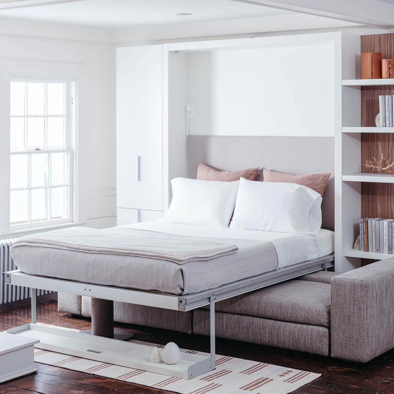 Fully extended queen wall bed from the Tango Sofa system, showcasing a luxury multifunctional sleeping solution in a bright, modern interior.