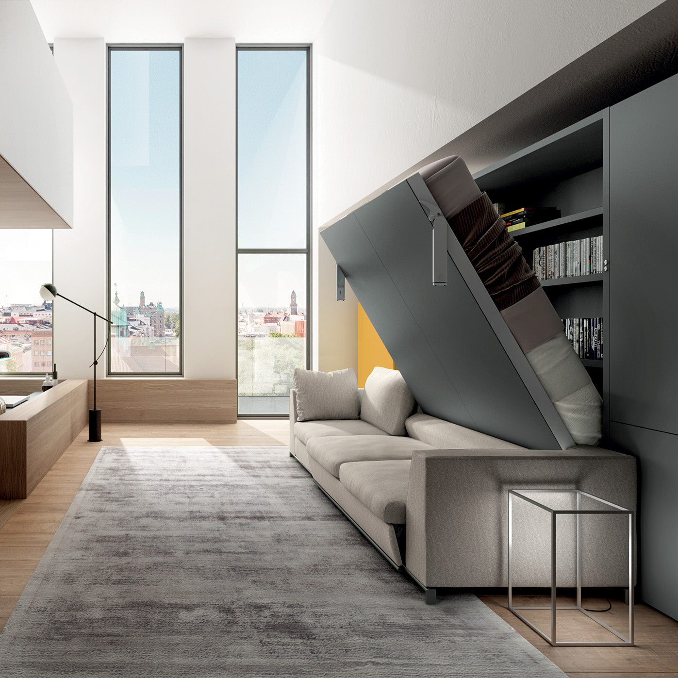 Tonale Sectional wall bed mid-transformation from sofa to bed, revealing hidden shelving in a double-height loft—an elegant multifunctional furniture solution.